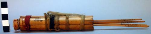 Blow gun arrow quiver made of reeds with cocoanut shell container for +