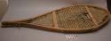Pair of snowshoes. Wooden frame of birch or larch with babiche. Light color.