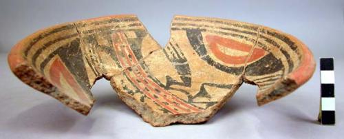 Restored polychrome potsherd - almost half of shallow vessel