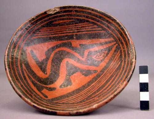 Black-and-red pedestal-base shallow pottery vessel