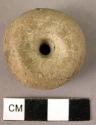 Baked clay spindle whorl
