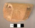 Pottery rim and handle fragment