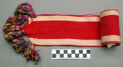 Woman's headband - red cloth with white stripes and tassels