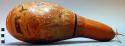 Elaborately carved and painted elongated gourd