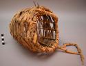 Wicker basket of wrapped weave with handle