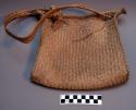 Man's large handbag of buriti frond straw