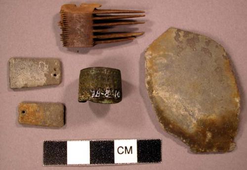 Pieces of zinc, and fragments of necklace made from it. Handwritten label relat