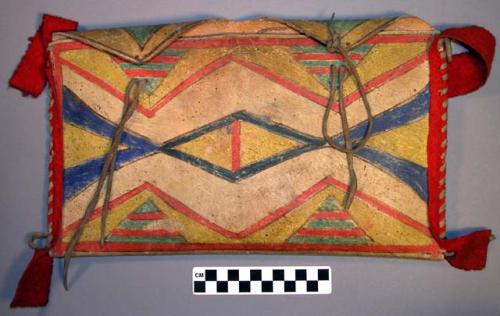 Parfleche or rawhide pouch or wall pocket; sides bound with rawhide thongs