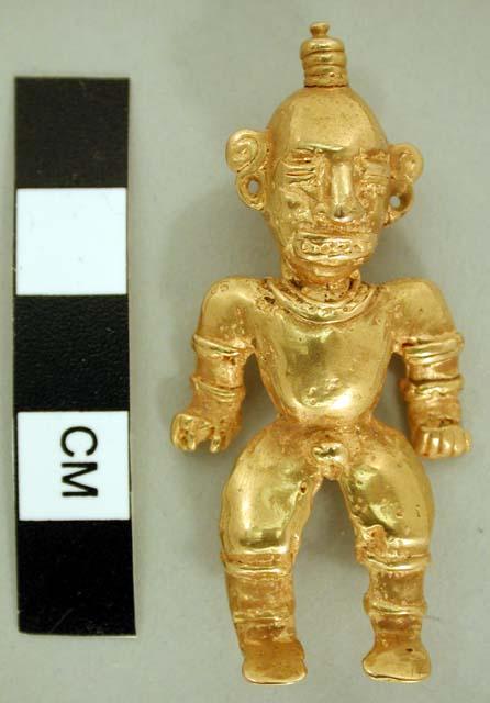 Human figure (male) in gold with topknot>  Loop on back.