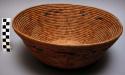 Bowl shaped basket, flowered design copied from carpeting