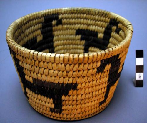 Flared basket, coiled. Design: black horses on light background.