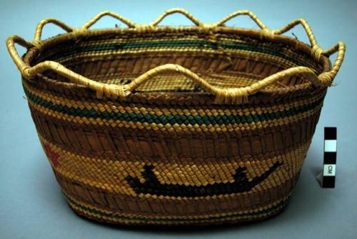 Wrapped twined oval grass basket with scalloped rim