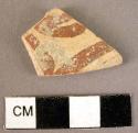 Potsherd - apparently a fragment of a naturalistic pattern