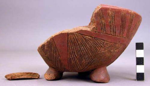 Bowl, with three feet.  Incised decoration.