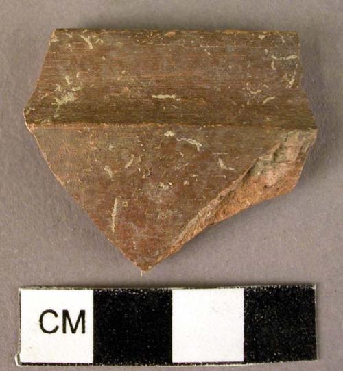 Thin, hard, glazed well burnished red rim potsherd