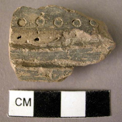 Potsherd - black Urfirnis ware - deep horizontal gashes and circular impressions