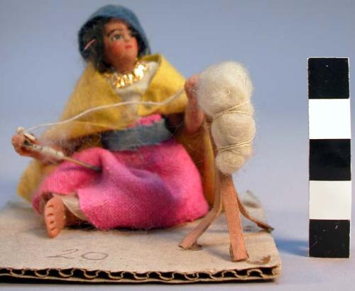 Wax figure of woman with spinning - "hiladora ambulante"