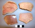 2 rim potsherds; 2 potsherds of flat bowls with spouts