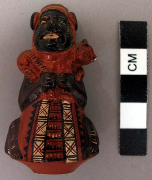 Miniature polychrome human effigy stirrup vessel, stirrup missing.