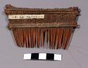 Wooden comb - woven together with string; used by older women