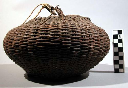 Bast fiber egg  basket with handle, made by women. native name: urura