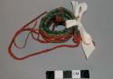 Miniature woolen belt - red, green, brown & white; double faced warp +
