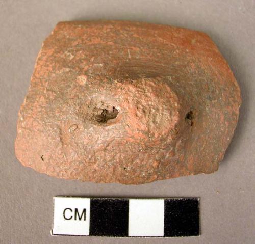 Rim potsherd with perforated lug