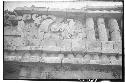 Mask-panel serpent motif. Right center figure. Palace. Str. 2BI.