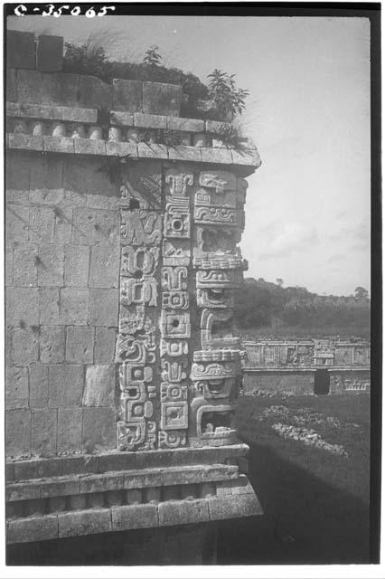 Mask-panel serpent motif. N.W. corner of East House, Monjas Quadrangle.