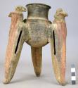 Tripod pottery vessel with modelled bird on each leg