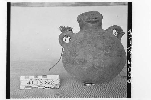 Pottery Jar with Animal Face on Neck of Vessel