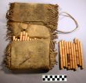 Leather pouch and 53 gambling sticks