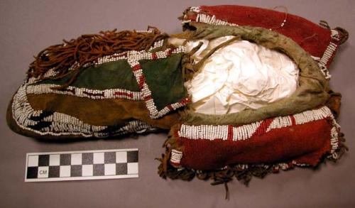 Pair of men's  moccasins. Yellow and green buckskin upper; rawhide sole