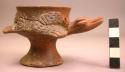 Restored small pedestal-base effigy pottery vessel and 3 sherds