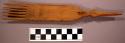 Navajo wood weaving comb. 6 tines. Top of comb is carved into step-like shape on