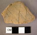 Rim potsherd of incised barbotine ware