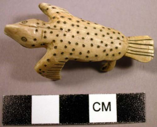 Bone charm? Incised seal with spots on back and flippers.