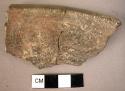 Rim potsherd of incrusted ware