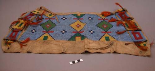 Sioux portion of an unfinished bag. Buckskin w/ lazystitch beadwork. Light blue