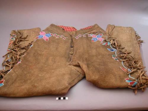 Smoked hide trousers, probably from the northern Plains. Beaded and fringed