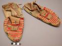 Pair of Sioux moccasins. Hard soles w/ soft uppers. Lazystitch beaded border