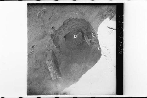 Vessels 6 and 7 and stone slab in situ at Cache 1 of Mound 7