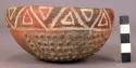 Small red bowl with geometric designs