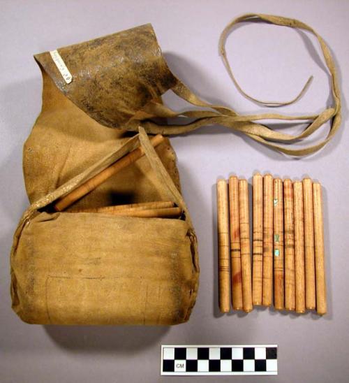 Gambling sticks and leather pouch