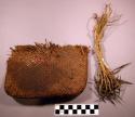 Bark pouch and 21 fish 'hooks' on sinew cords
