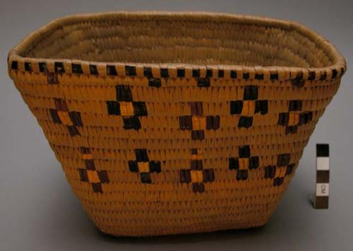 Trinket basket, imbricated design on coiling.