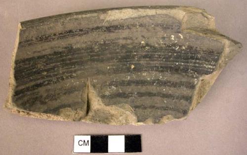 Rim potsherd of burnish decorated ware (graphite?)