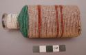 Sioux beaded bottle. Bottle covered w/ red cloth w/ white dots and then wrapped