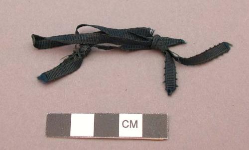 Small black ribbon fragment