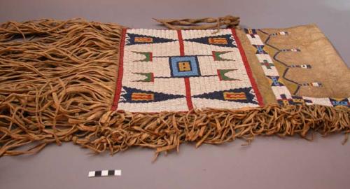 Sioux saddle bag. Buckskin w/ long fringe on each end and short fringe along sid